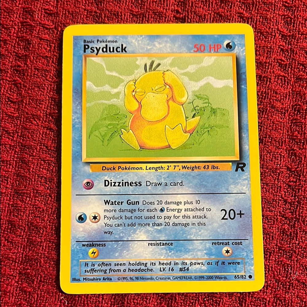 PSYDUCK. Pokemon Trading Card with Blue and Red Design
